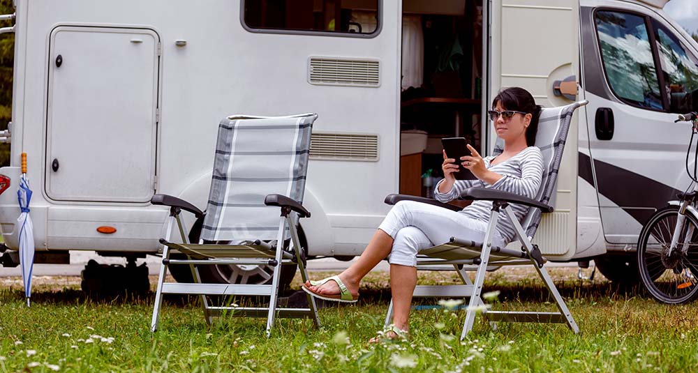 Woman using a tablet to check her rv inspection report